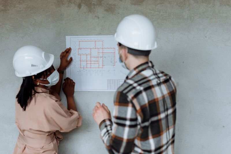 Detailed architectural blueprint and drafting tools for an Auckland home design