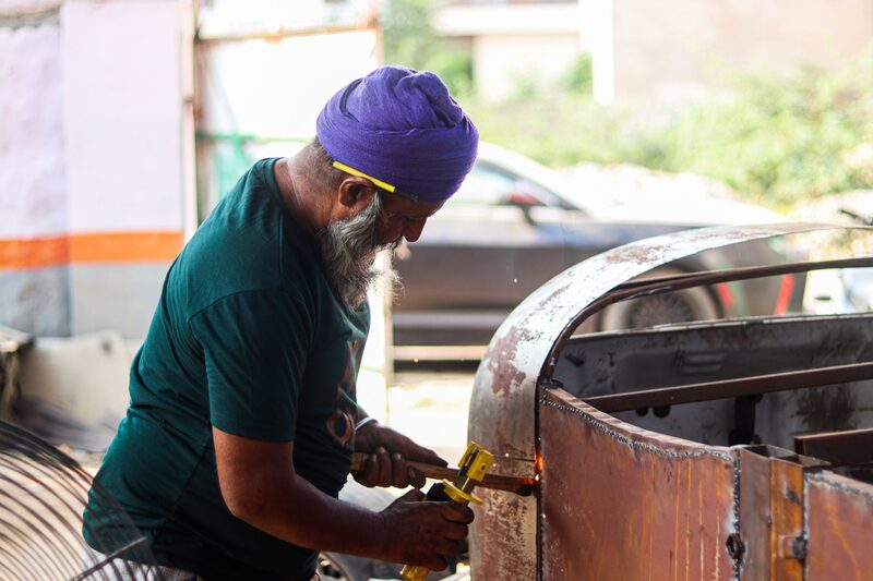 Auckland auto body shop technician repairing a damaged car panel