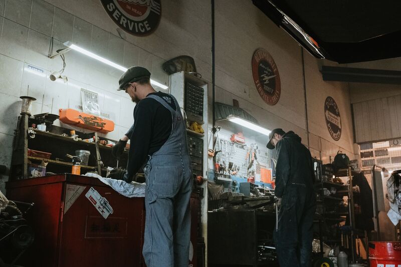 Car being serviced on a hoist in an Auckland repair garage