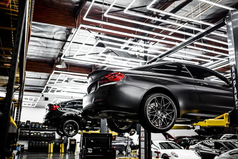 Technician servicing a vehicle in an Auckland auto repair garage