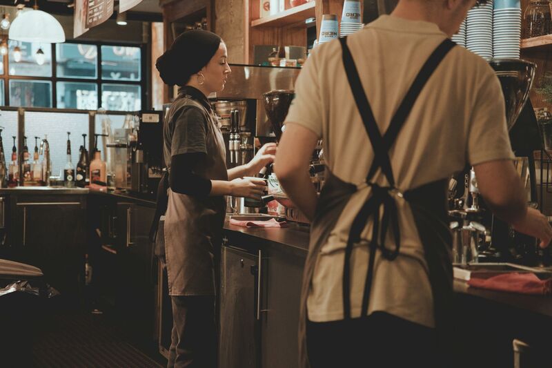 Barista preparing coffee at an Auckland café that ranks for local search queries