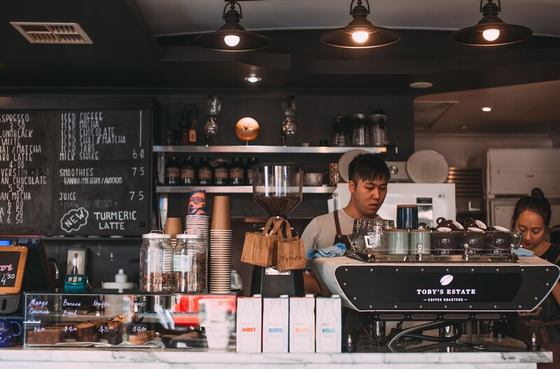 Barista serving a customer at an Auckland cafe surfaced through AI and voice search