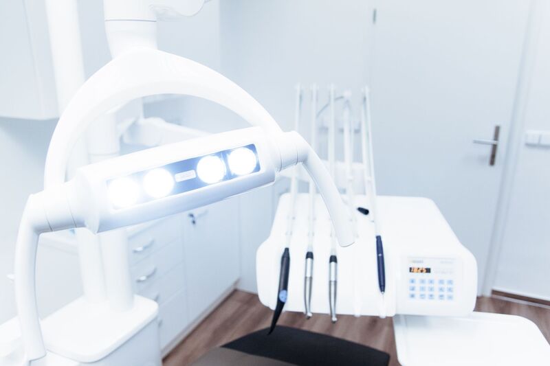 Modern dental clinic interior in Auckland with a treatment chair and equipment