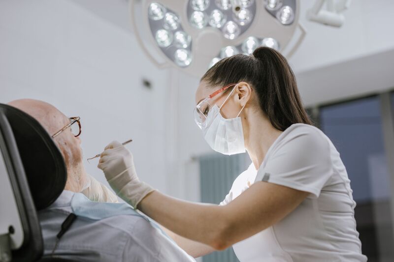 Dentist treating a patient at an Auckland dental practice