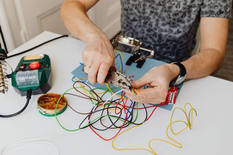 Electrician working on installation for an Auckland electrical services business