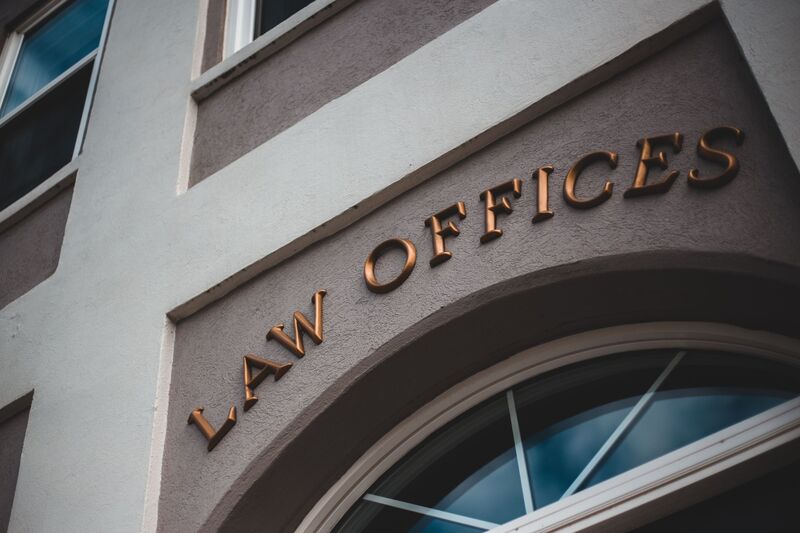 Auckland lawyers reviewing legal documents in a firm office