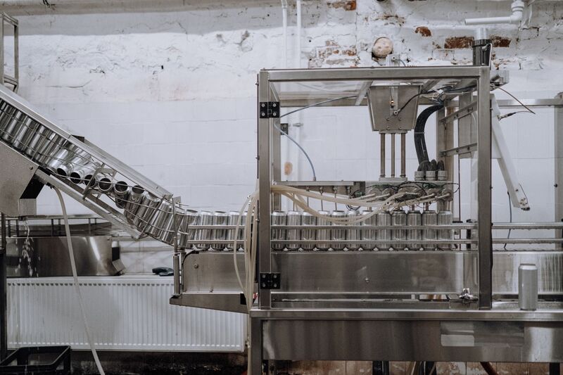 Factory workers operating machinery on an Auckland manufacturing floor