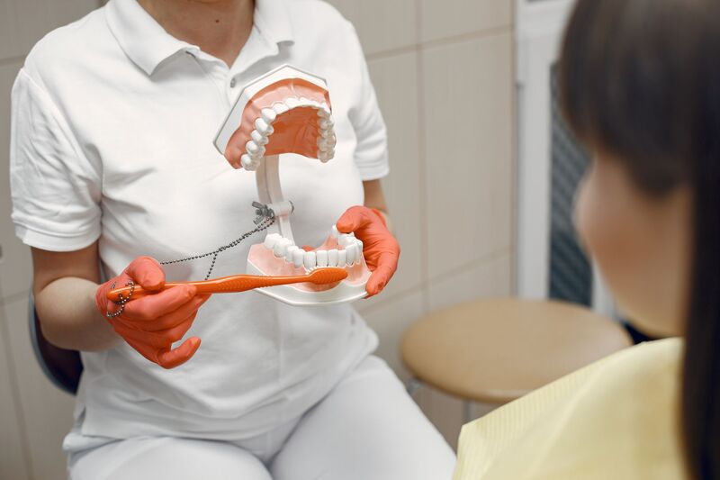 Orthodontist reviewing a patient's smile at an Auckland orthodontic practice