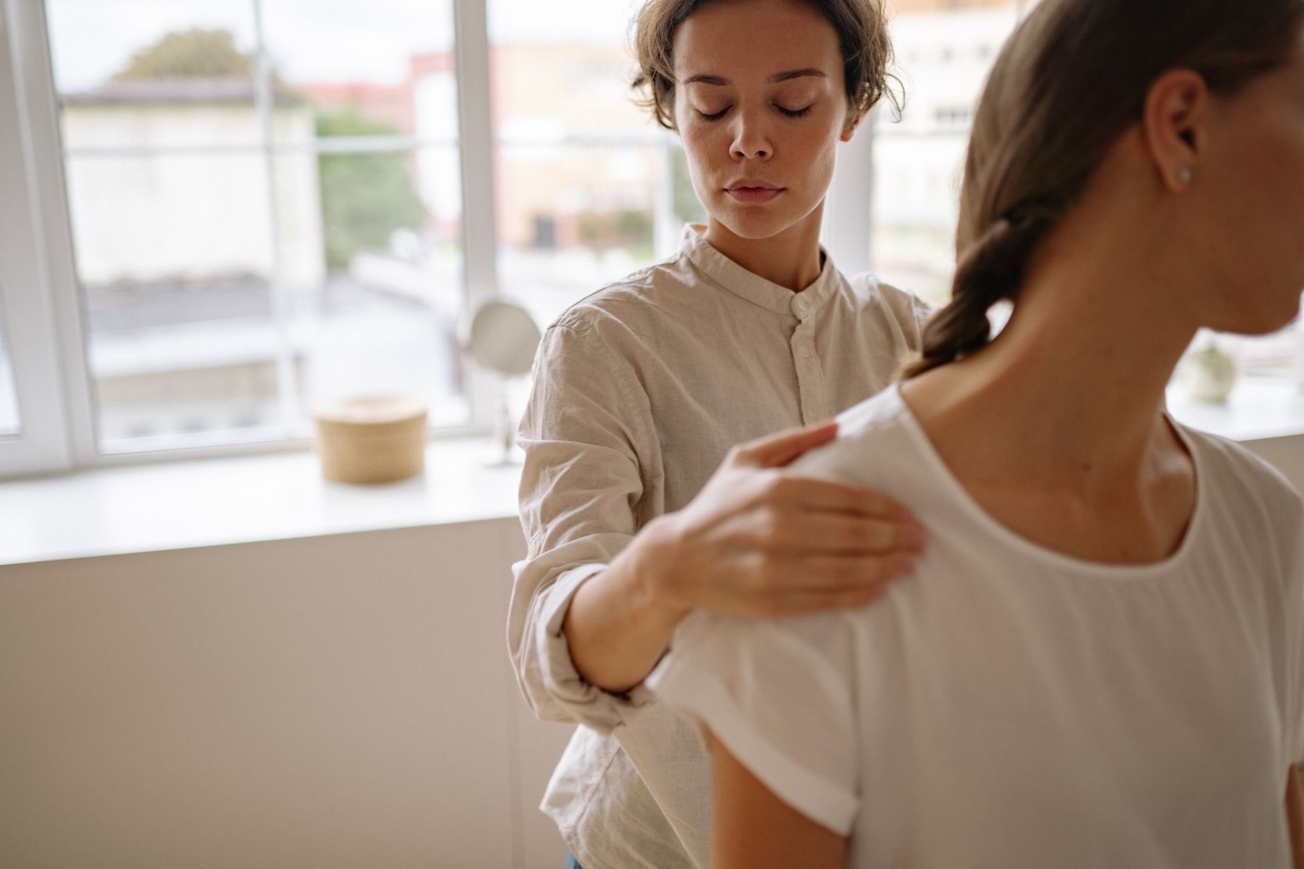Physical therapist guiding a patient through recovery in Auckland
