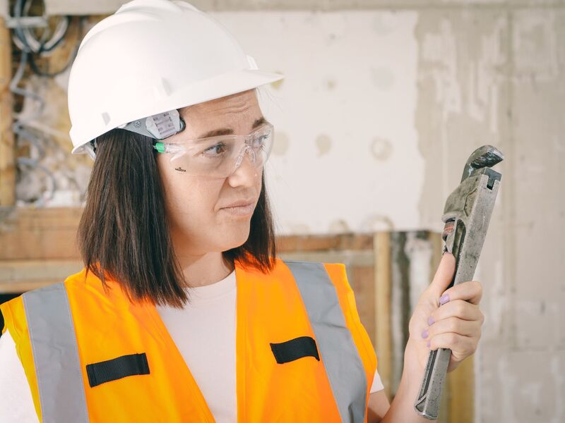 Professional plumber at work on a job in an Auckland home
