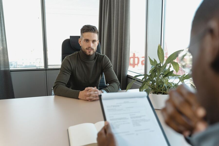Recruitment consultant conducting a job interview at an Auckland recruiting agency