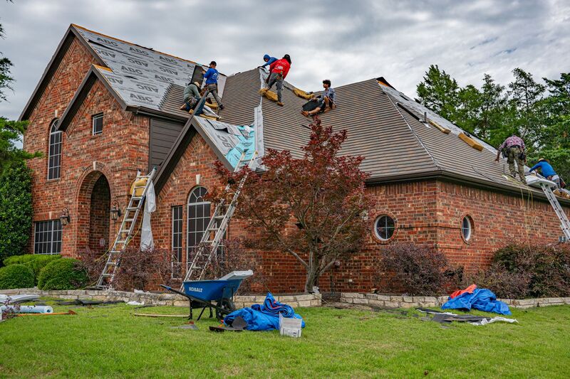 Roofer installing a new roof on an Auckland property