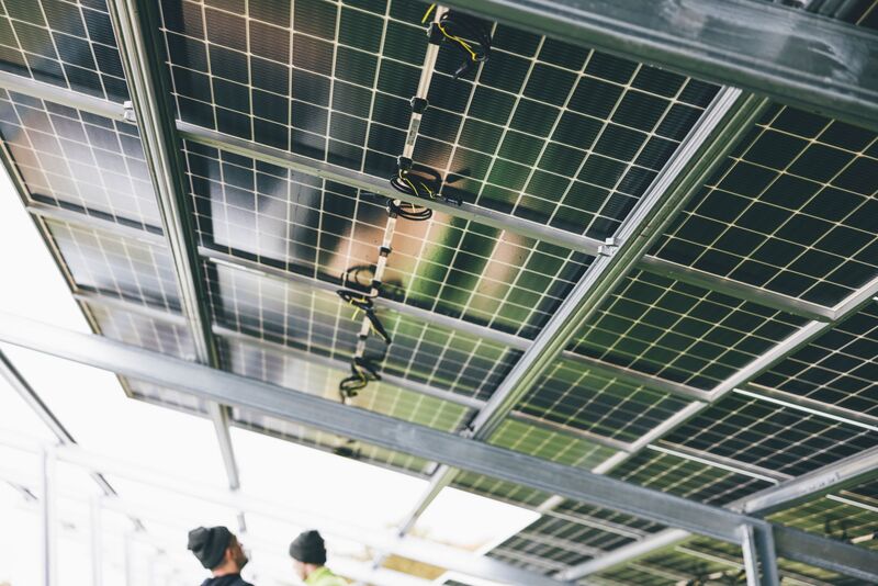 Commercial solar array being installed on an Auckland rooftop