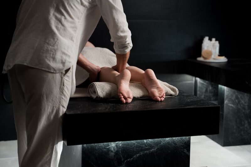 Therapist giving a relaxing massage at an Auckland spa