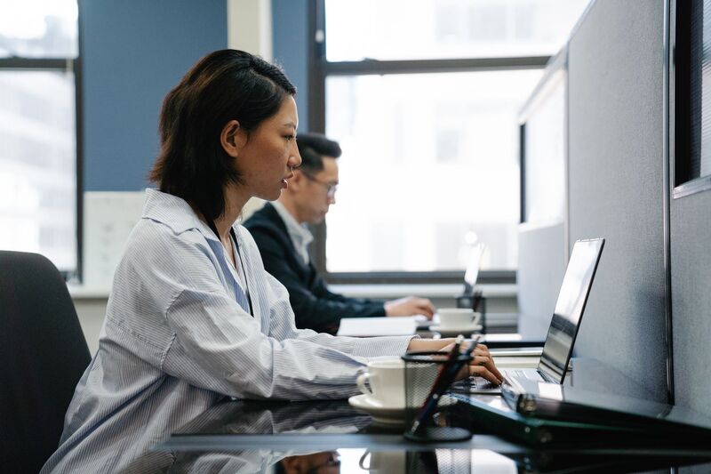 Auckland office workers collaborating in a modern recruitment workplace