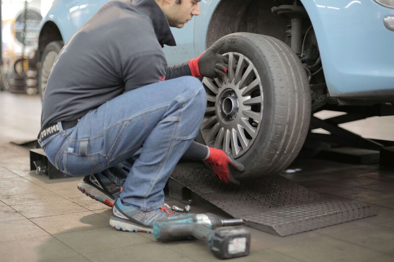Close-up of a car tyre being changed and inspected in Auckland